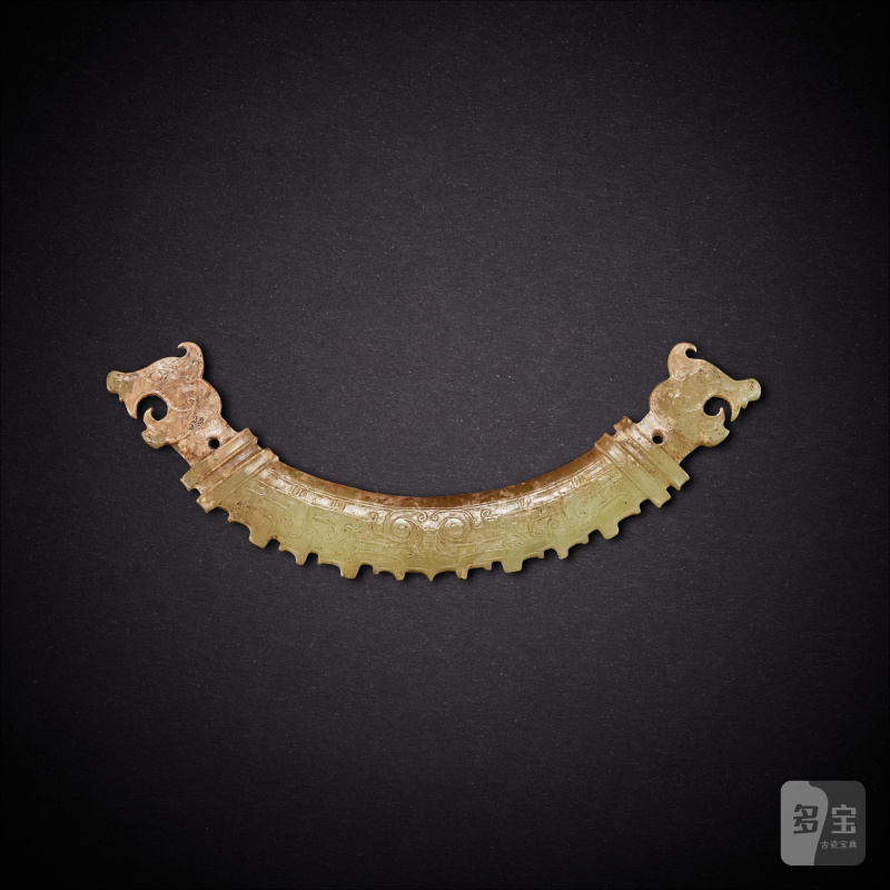 A yellowish-celadon jade 'tiger' pendant, huang, Western Zhou dynasty | 西周 青黃玉虎首璜